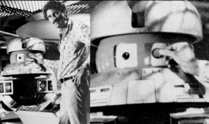 Director Gary Nelson applying V.I.N.cent's original Ferranti-Packard disk, which had to be abandoned because of technical difficulties